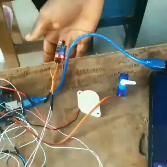 Servo actuator under test with live readings on a serial monitor